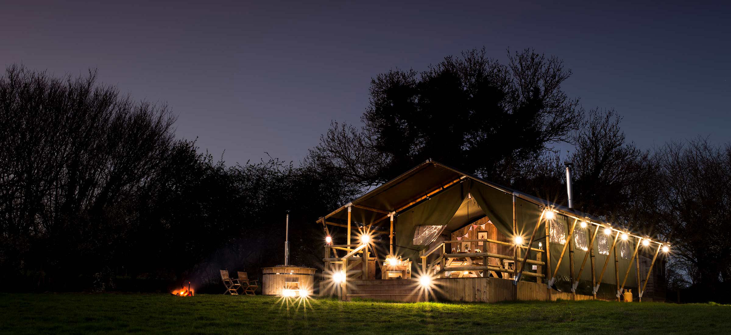 Glamping Safari Tent lit up at night near Exeter Devon