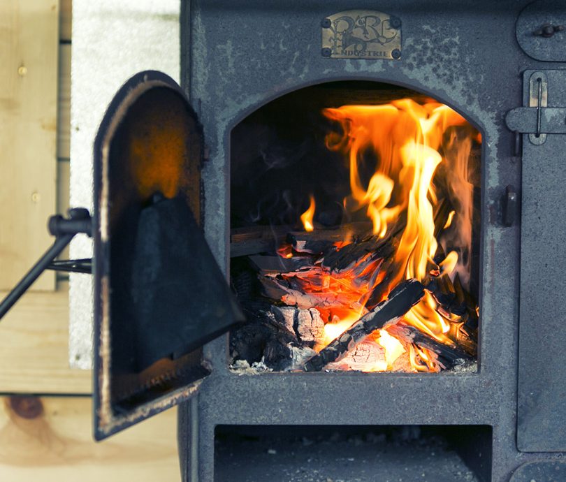 Wood burner inside a glamping tent