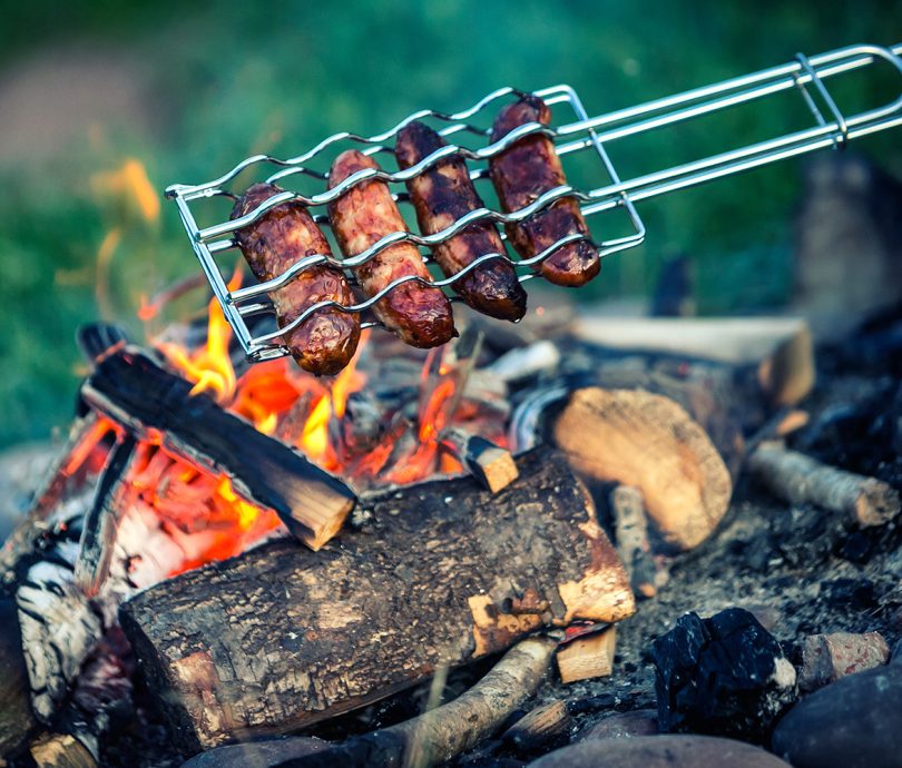 Barbecuing sausages on holiday