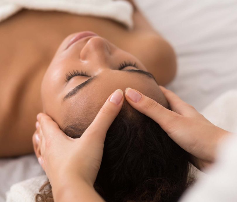 Woman enjoying a swedish massage whist on a glamping holiday in Devon